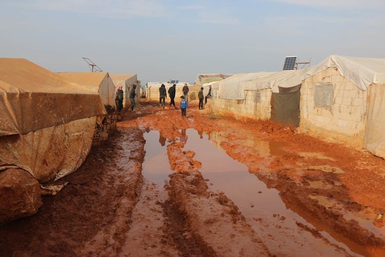 People Walking In Refugee Camp