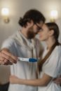 Man in White Dress Shirt Holding Blue and White Pregnancy Test
