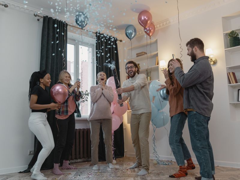 Guests looking at blue confetti in the air