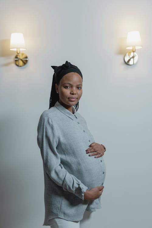 Free A Pregnant Woman Wearing Button Down Long Sleeves Stock Photo