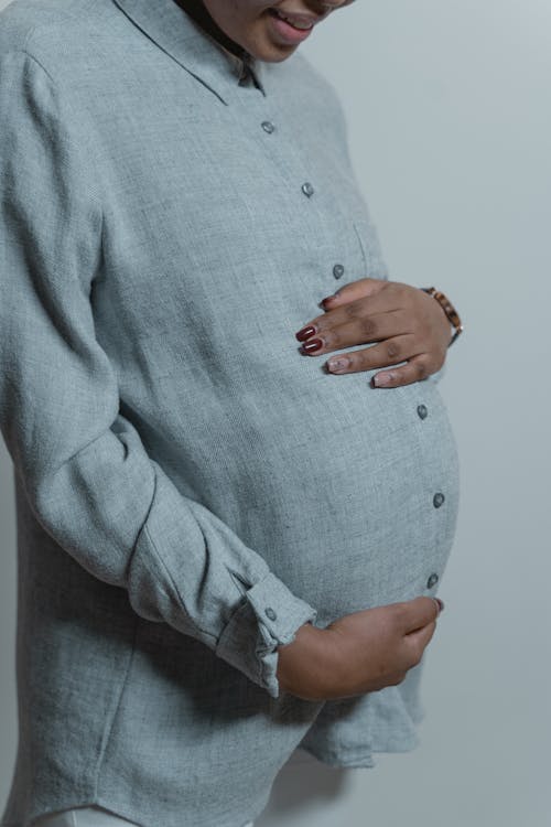 A Close-Up Shot of a Pregnant Woman