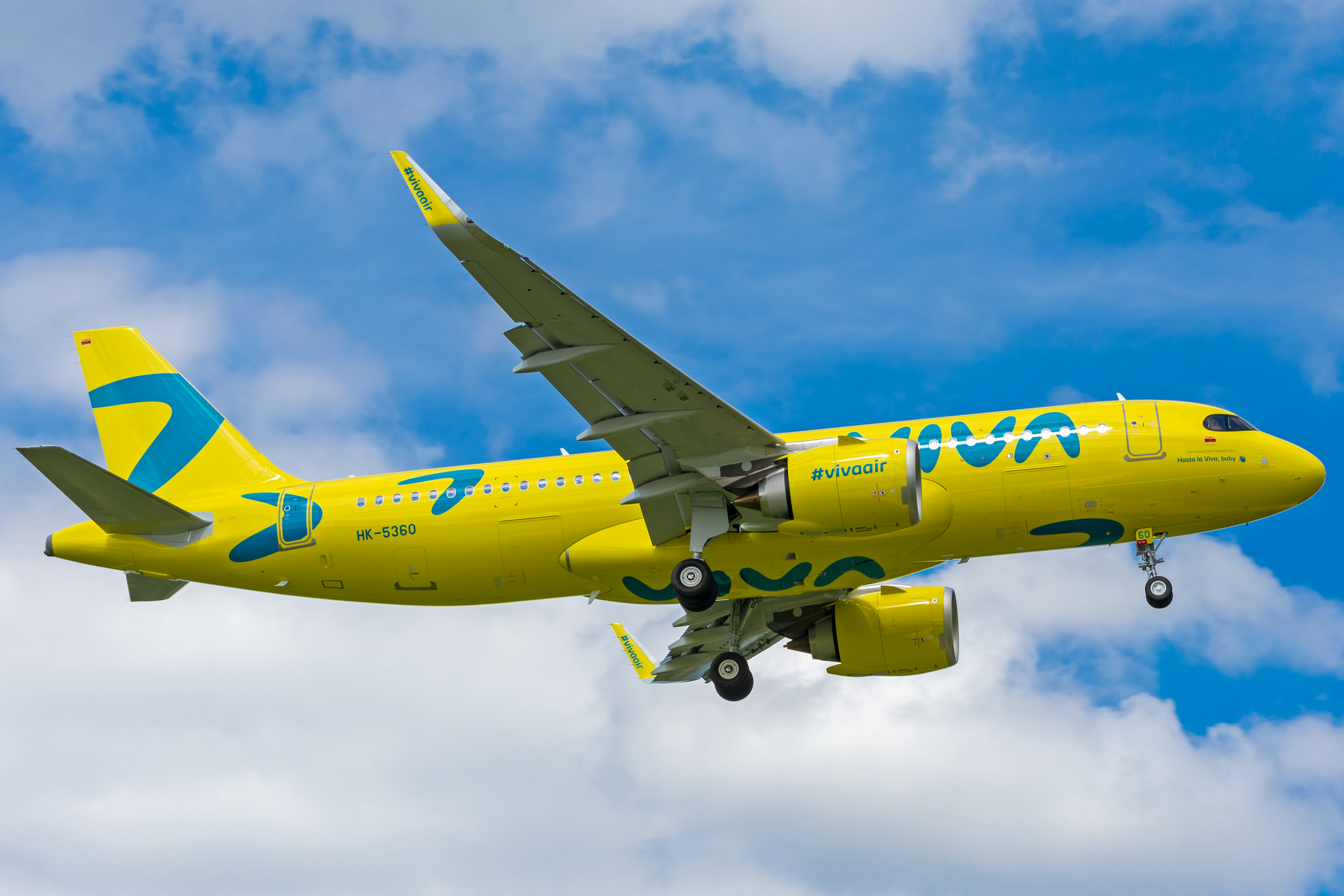 A Yellow Airplane Flying in the Sky · Free Stock Photo
