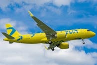 A Yellow Airplane Flying in the Sky