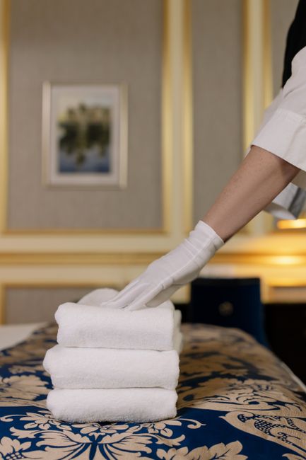 Styling example: a faux fur throw neatly folded on a hotel bed