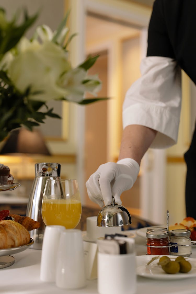 Person Checking Order From Hotel Room Service