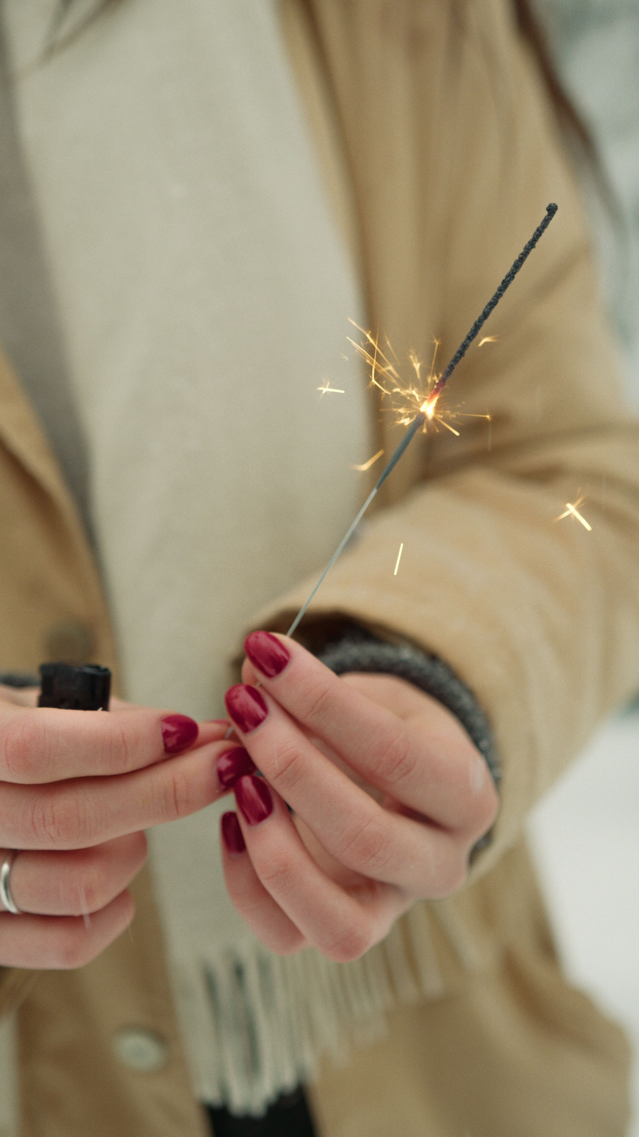 Woman Holding a Lighted Sparkler · Free Stock Photo