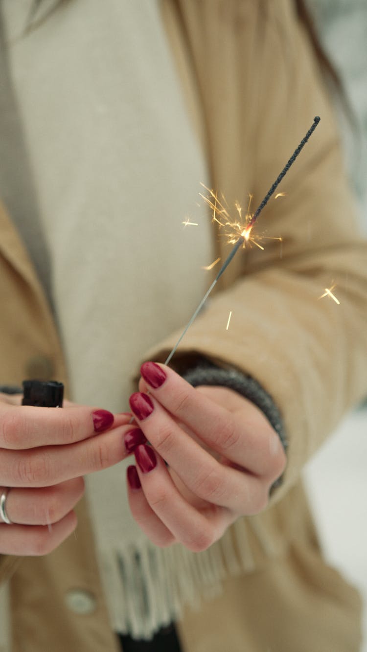 Woman Holding A Lighted Sparkler