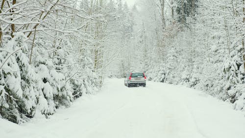 A Vehicle on Snow Covered Road