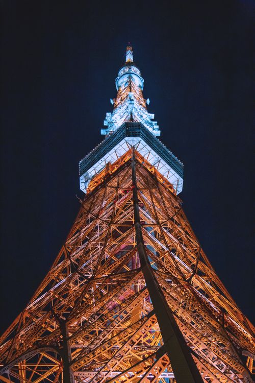 Free Stunning view of the Tokyo Tower lit up against the night sky in Minato City, Tokyo, Japan. Stock Photo