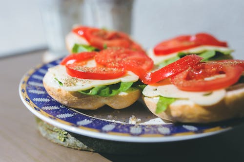 Sandwiches with cheese, lettuce and tomato on a plate