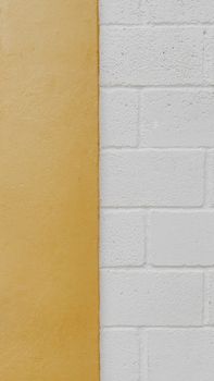A close-up of a minimalist, dual-toned wall showcasing a smooth and textured surface.