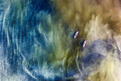 Free Painting of Two Boats on a Stormy Sea Stock Photo