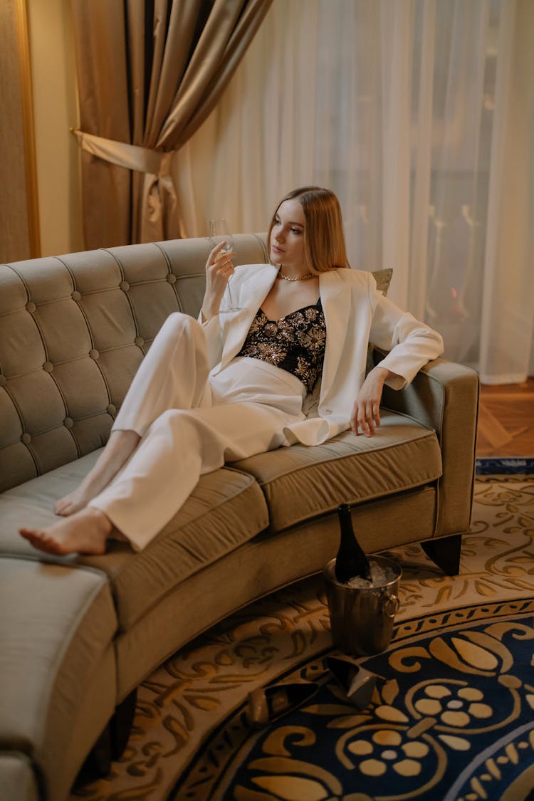 Photo Of A Woman Laying On Sofa