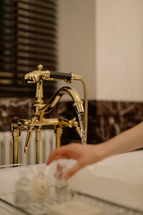 Free Close-up of a Faucet with Running Water Stock Photo