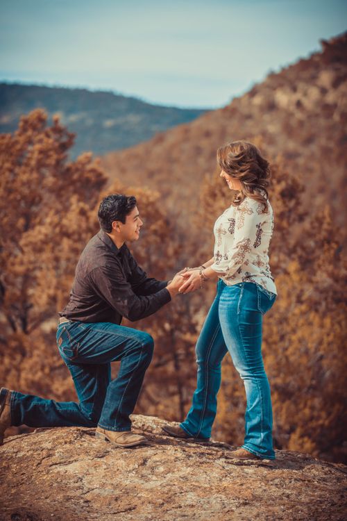 Proposing Position A Man Kneeling while Proposing to Her Partner · Free Stock Photo