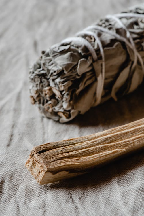 Free A Bundle of Sage Beside the Piece of Wood Stock Photo