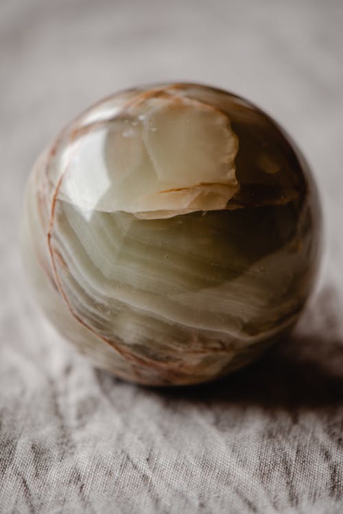 Free A Close-Up Shot of a Sphere Marble Stock Photo