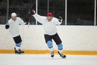 Men Playing Ice Hockey while Holding a Hockey Sticks