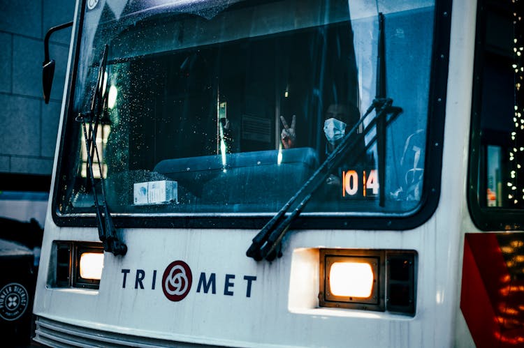 Anonymous Driver Of Tramway Showing V Sign And Looking At Camera