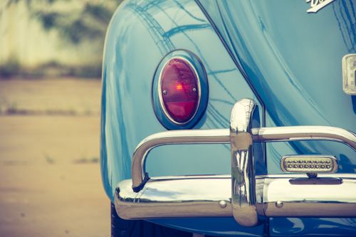 Free Elegant close-up of an old blue vintage car tail light with chrome details. Stock Photo