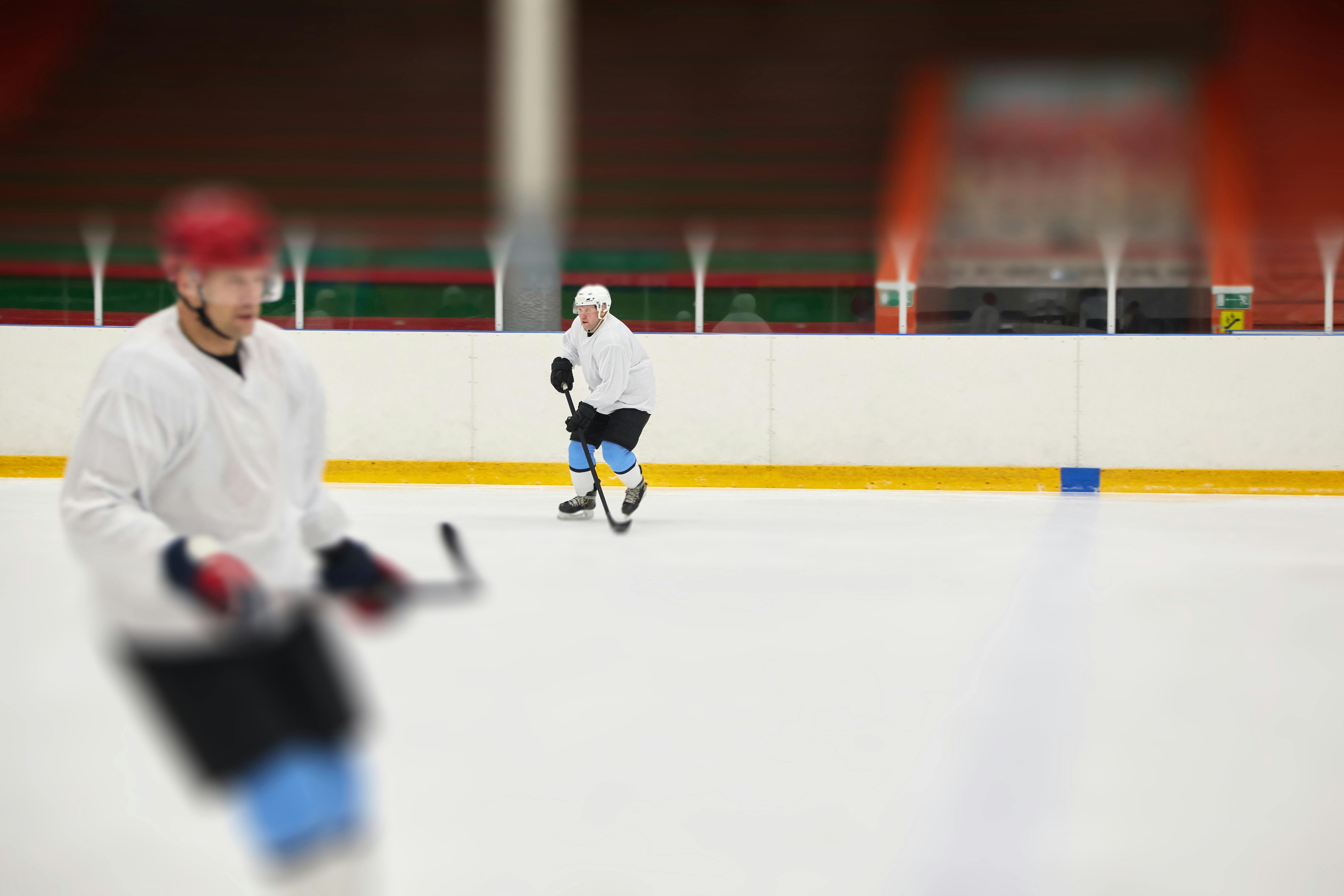 men playing ice hockey