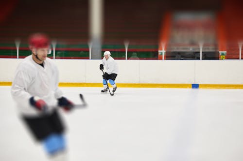Free Men Playing Ice Hockey Stock Photo
