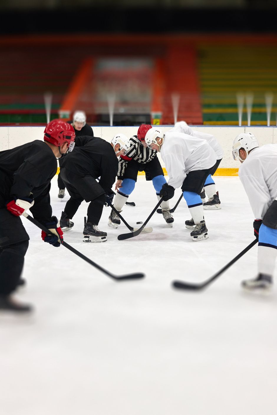 Hockey players battling for the puck