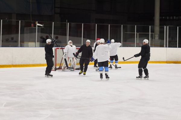 Two Ironvale players contesting the puck at speed