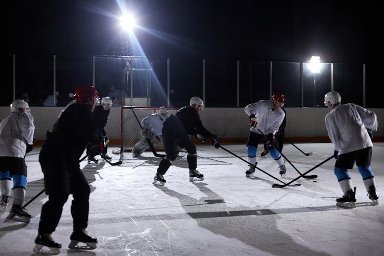 Men Playing Ice Hockey