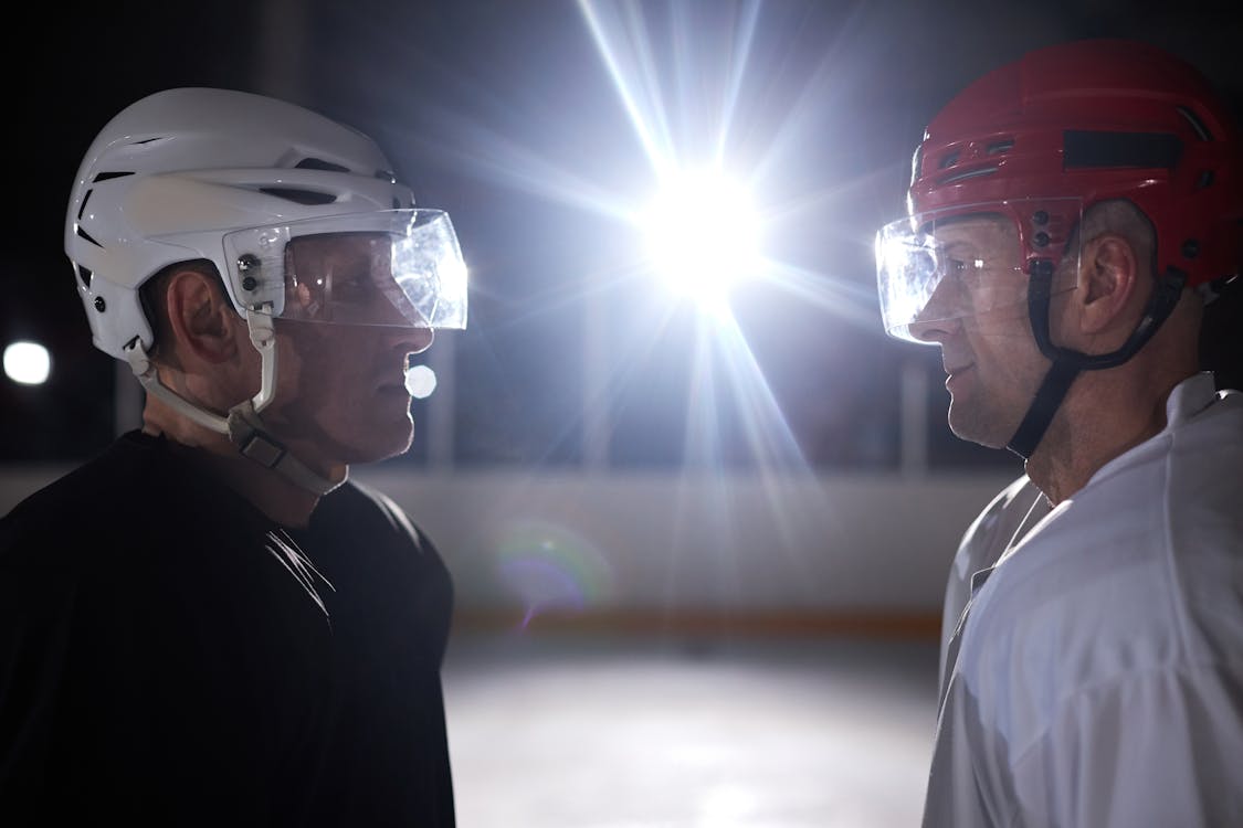 Two Competitive Ice Hockey Players Looking at Each Other