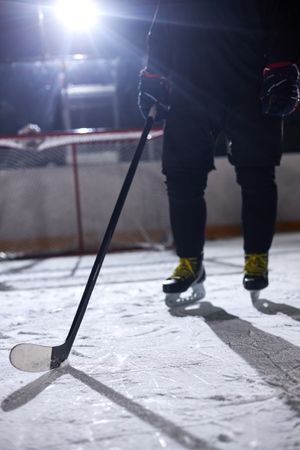 Youth and amateur hockey players practicing skating drills at an ice rink