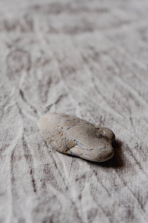 Gray Stone on White Textile