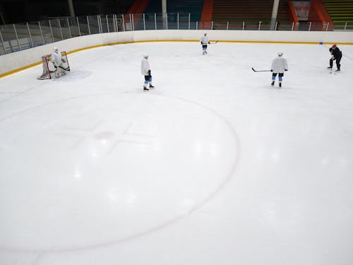Free High-Angle Shot of Men Playing Ice Hockey Stock Photo