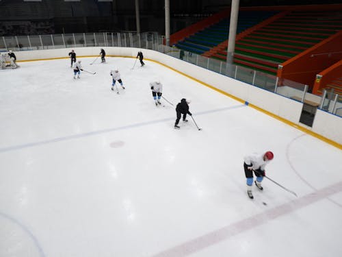 High-Angle Shot of Men Playing Ice Hockey