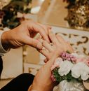 Man Putting the Ring on Her Wife