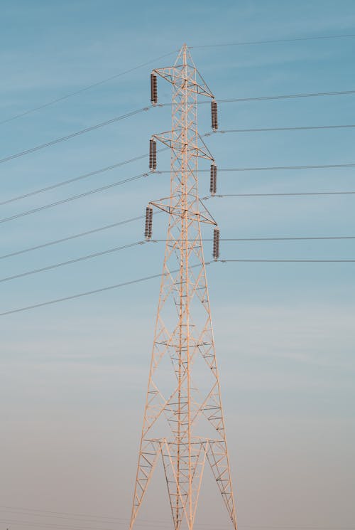Brown Electric Tower Under Blue Sky
