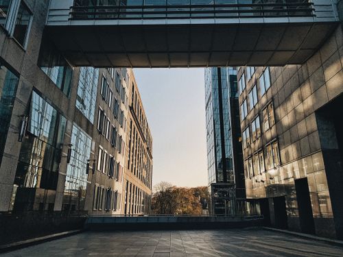 Free A stunning view of modern architecture in Brussels, captured at sunset, showcasing sleek glass facades. Stock Photo