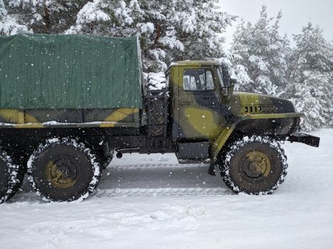 A Truck on a Snow Covered Ground