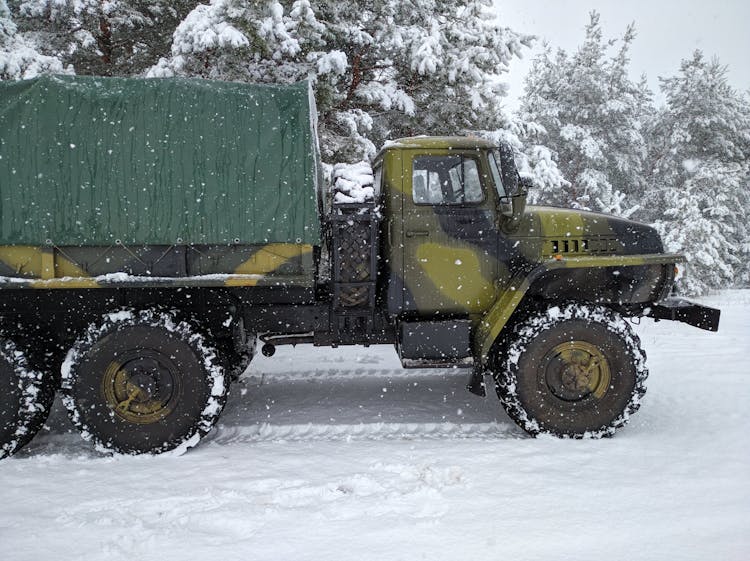 A Truck On A Snow Covered Ground