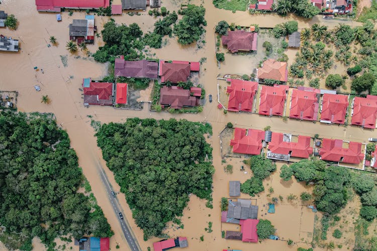 Roofs Of Residential Houses In Flooded Town