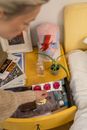 A Person Discovering Three Pink Condoms from a Bedside Table