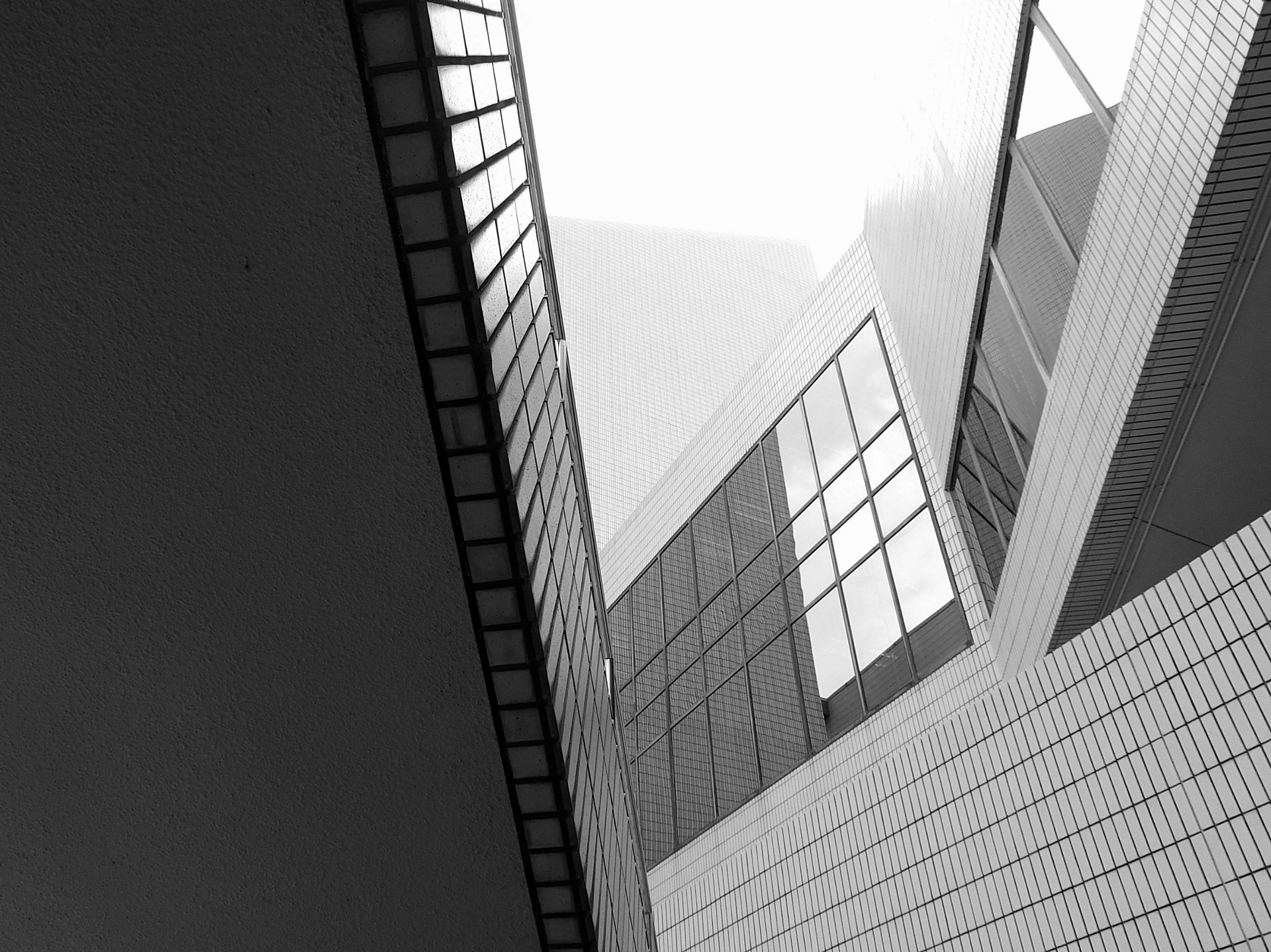 A sleek view of Hong Kong's modern architecture, highlighted by geometric elements and glass facades.