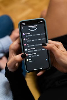 Close-up of woman using a smartphone health tracking app, focusing on personal wellness data.