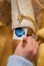 Close-Up Shot of Person Holding a Blue Condom in a Pack