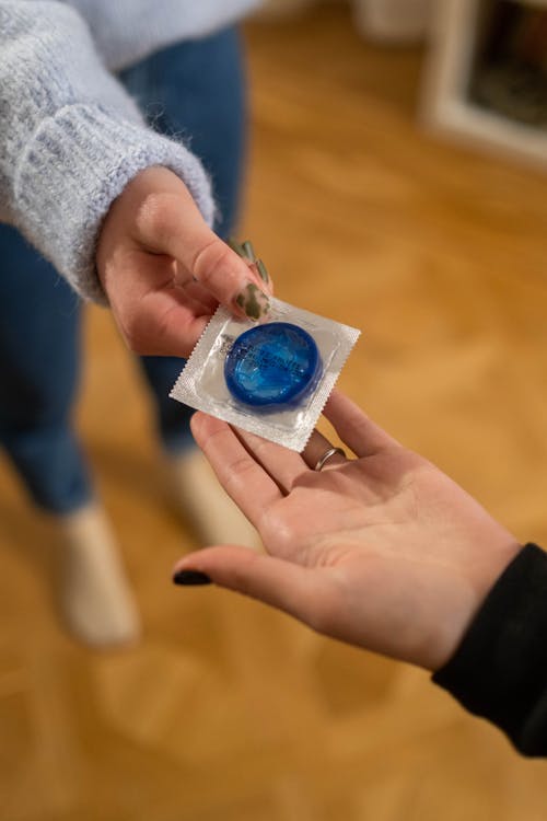 Handing Out Blue Condom