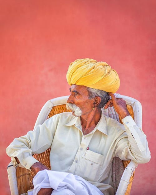 Man in Beige Dress Shirt and Yellow Turban
