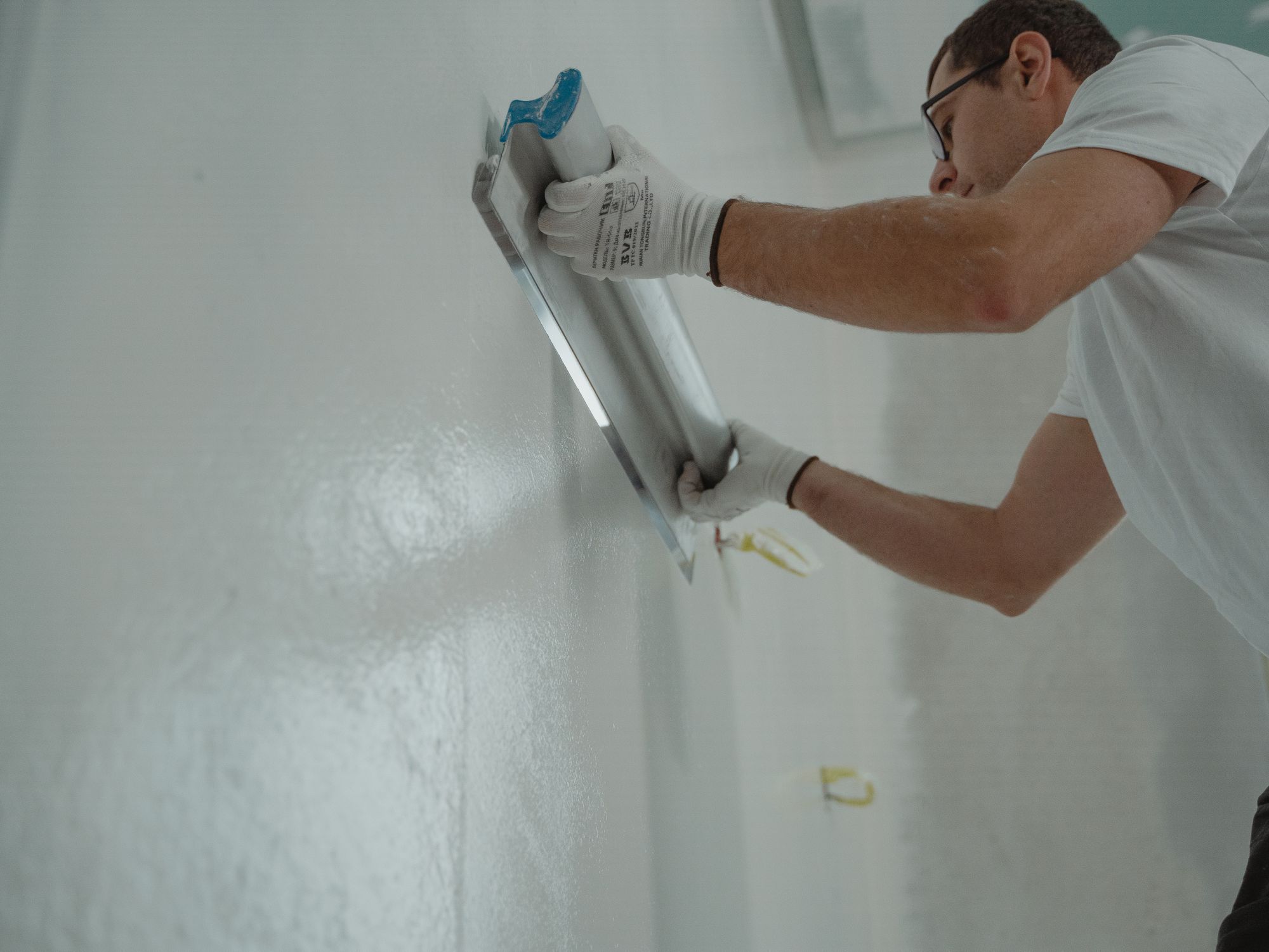 Exterior Painting in Newbury Park, Redbridge — painter refreshing a house exterior in weatherproof paint