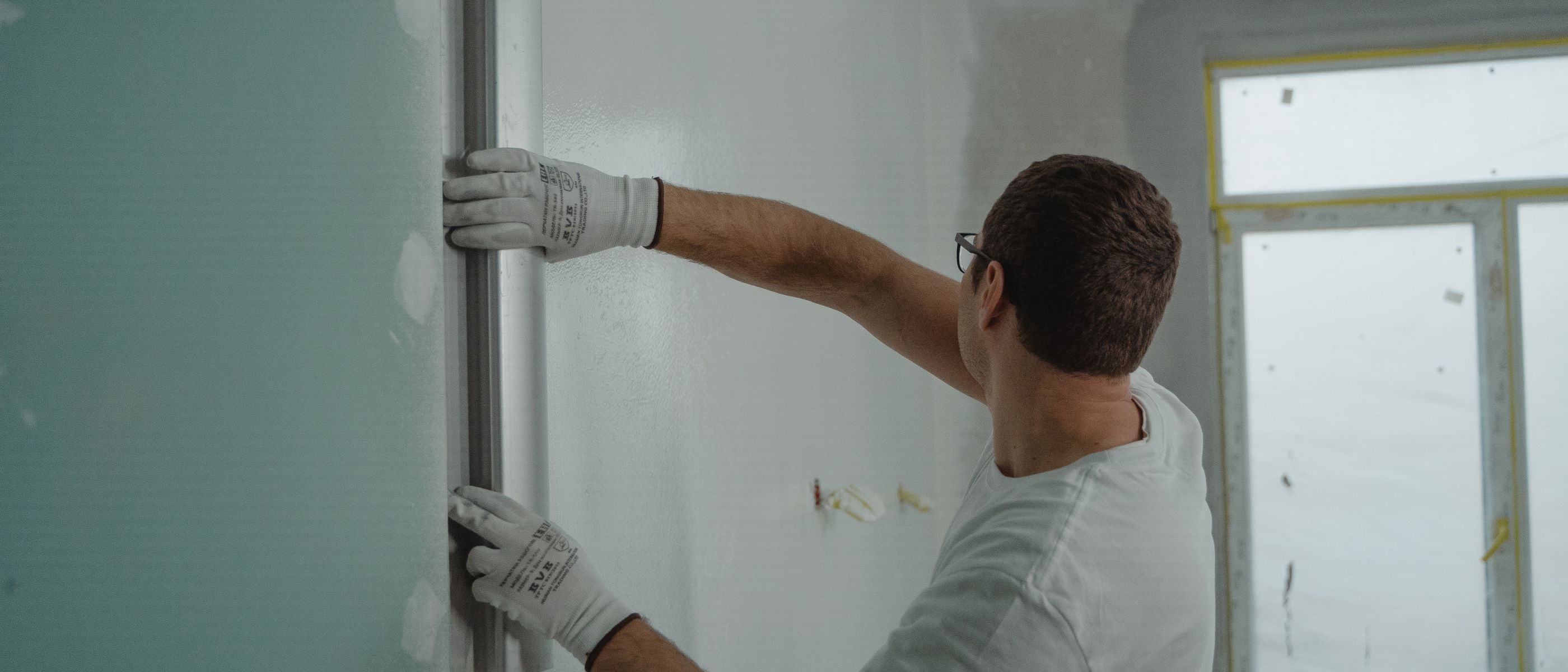 Plastering and Skimming in Leytonstone — a decorator at work mid-project