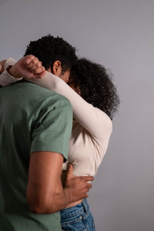 Free Woman Embracing a Man Stock Photo