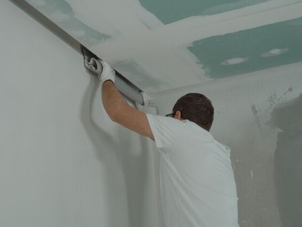 New drywall sheets installed on interior wall studs